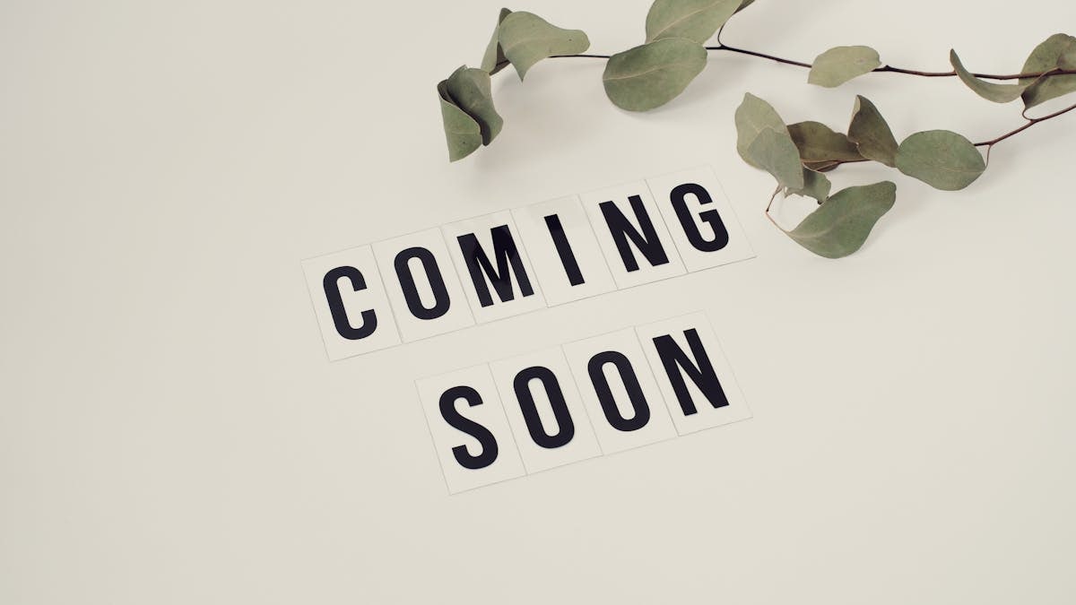 Eucalyptus branch with 'Coming Soon' message on white background for announcements.